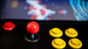 Focus on the buttons and the joystick of an arcade machine